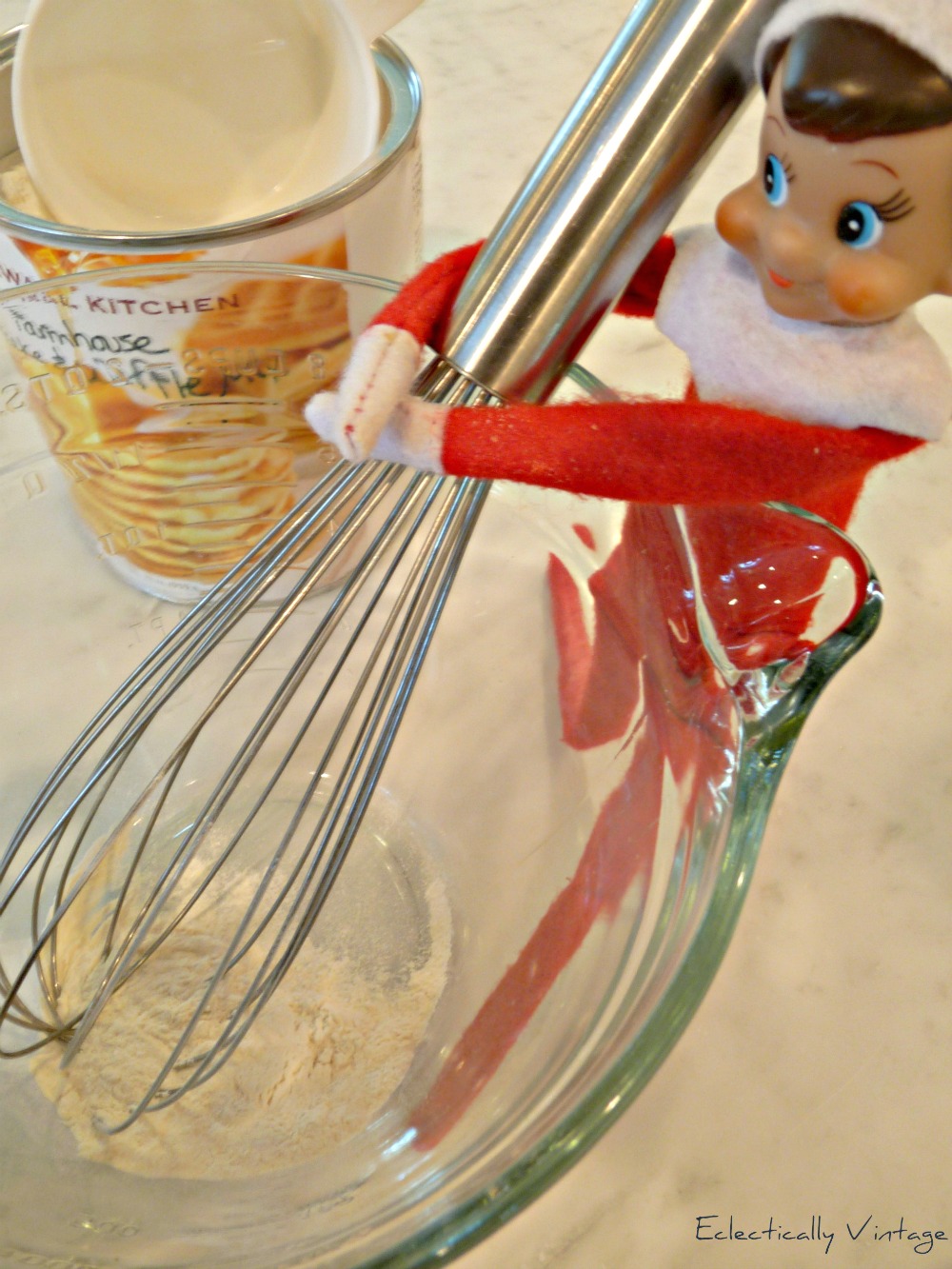 18 Hysterical Elf on the Shelf ideas! #elfontheshelf kellyelko.com This Elf on the Shelf whips up a fluffy stack of pancakes 