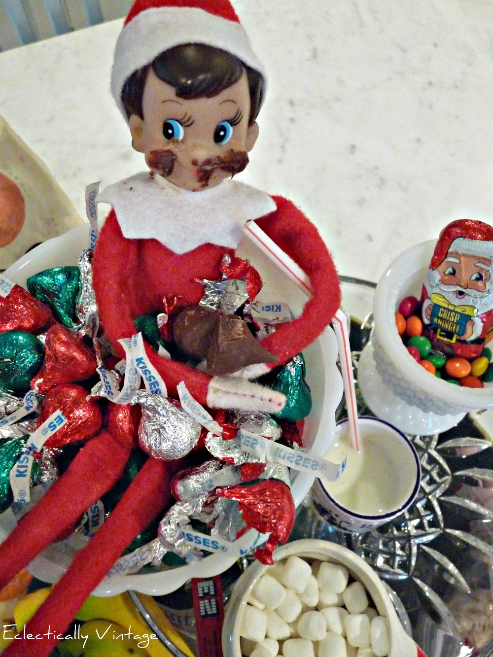 18 Hysterical Elf on the Shelf ideas! #elfontheshelf kellyelko.com This little Elf on the Shelf is on a sugar high after raiding the candy jar!
