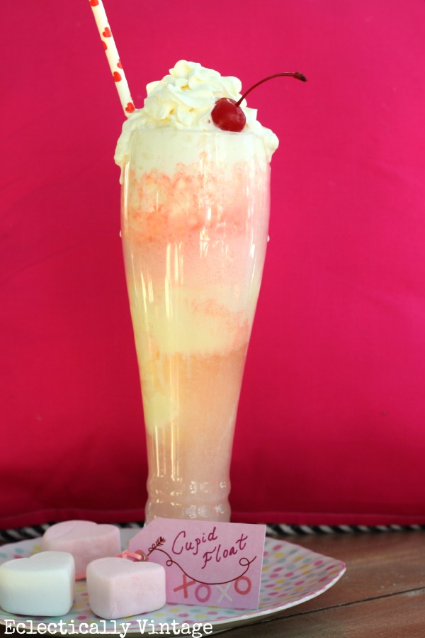 Cupid Float Valentine Drink - perfect for the kids! kellyelko.com #valentine #valentinesrecipe #valentinesday #valentinesparty #kidsvalentine #kidsdrinks #kidsrecipes #recipes #cupidfloat