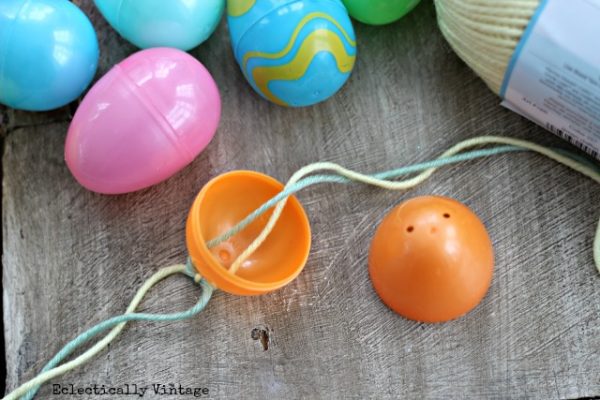 How to make an egg garland - you have to see how cute this is! kellyelko.com #spring #springcrafts #easter #eastercrafts #kidscrafts #crafting #crafts #diyideas #diyprojects #springmantel #springdecor