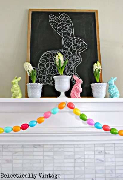 Make an Easter egg garland - what a fun spring mantel! kellyelko.com #spring #springcrafts #easter #eastercrafts #kidscrafts #crafting #crafts #diyideas #diyprojects #springmantel #springdecor