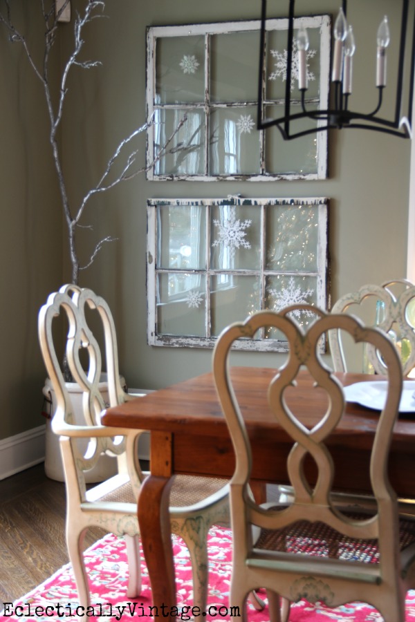 Antique windows covered in snowflakes make a fun Christmas decorating idea kellyelko.com