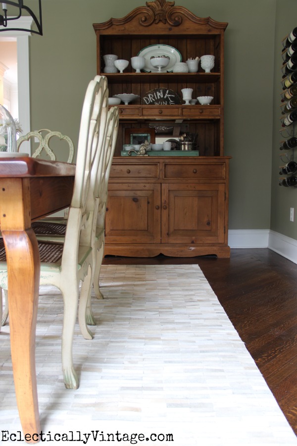 Beautiful dining room and love the pieced cowhide rug! kellyelko.com