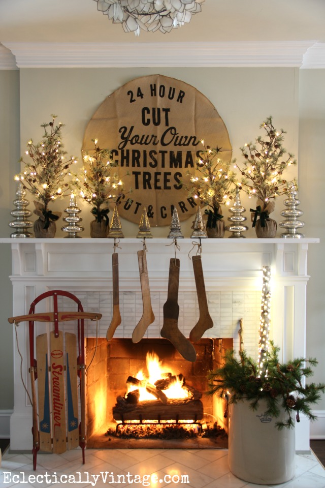 Glowing Christmas Mantel with Trees and sled kellyelko.com