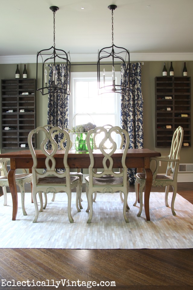 Dining Room Wine Cellar - Create a wine cellar in your dining room with these rustic wine cubbies! Love the way they fill up the walls and replace art kellyelko.com #winecellar #diningroomdecor #wine #diningroom #lighting #chandelier #rusticdecor #eclecticdecor 