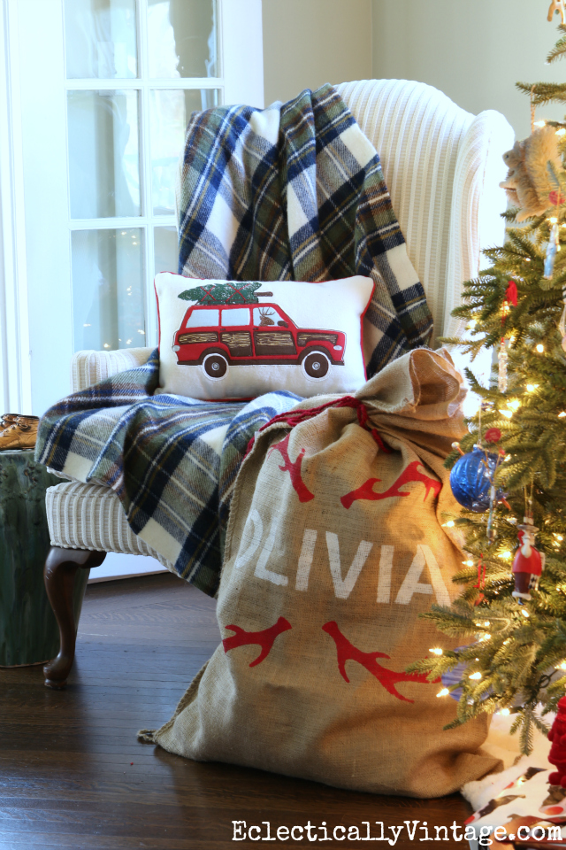 Cozy plaid throw and Christmas car pillow are fun by the tree kellyelko.com