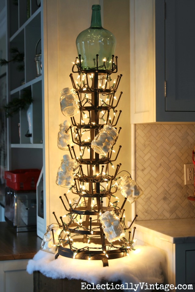 Creative Christmas Decorating Ideas - love this wine bottle holder turned Christmas tree kellyelko.com