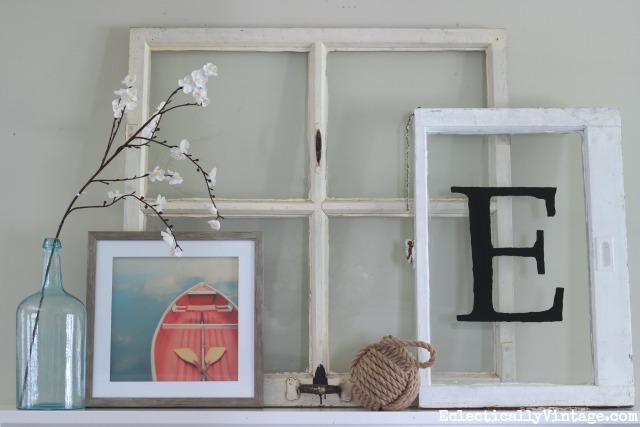 Lean antique windows on a mantel for a fun spring look kellyelko.com
