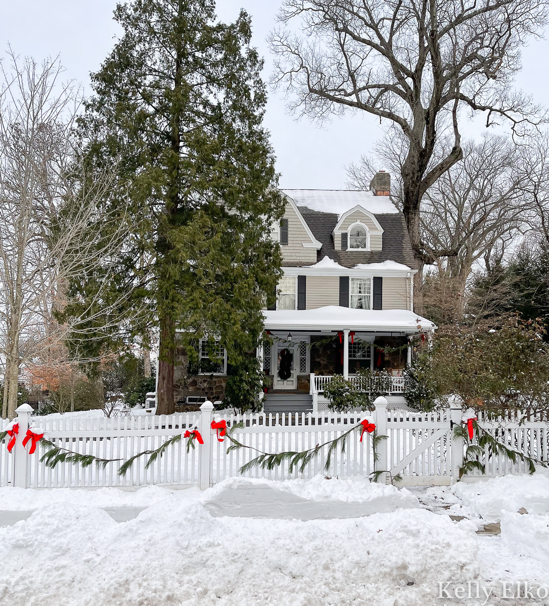 Love this beautiful snow covered old house and picket fence with garland kellyelko.com