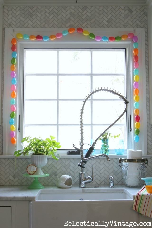 Spring Home Decorating Tour - tons of great ideas to freshen up your home like the colorful DIY egg garland kellyelko.com #spring #springdecor #springdecorating #springcrafts #hometour #housetour #eclectichome #farmhousedecor #fixerupperstyle #jadeite #farmhousestyle #vintagedecor #vintagehome #kellyelko #diygarland #diycrafts #springcrafts #kidscrafts #eastereggs 