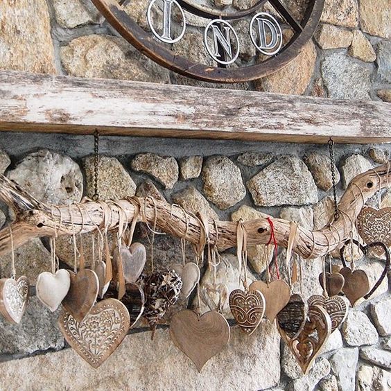 Heart collection hung from a rustic branch kellyelko.com