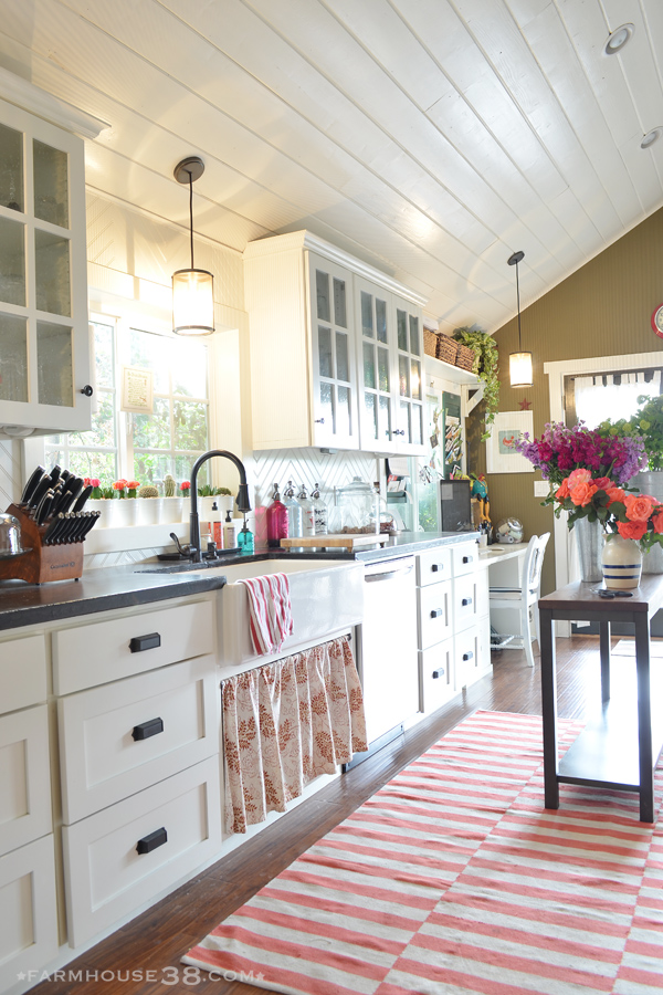 Eclectic Home Tour of Farm and Foundry - love her whimsical sense of style and this white kitchen with planked ceiling kellyelko.com