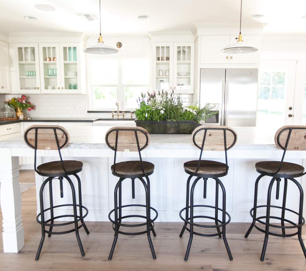 Farmhouse kitchen with industrial barstools kellyelko.com