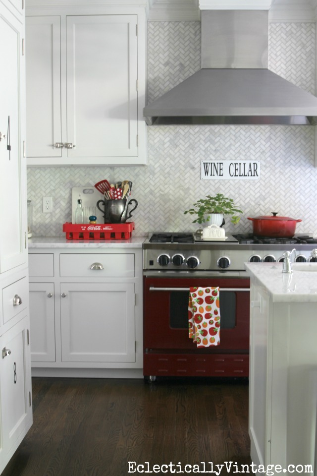 Red stove with carrara marble backsplash kellyelko.com