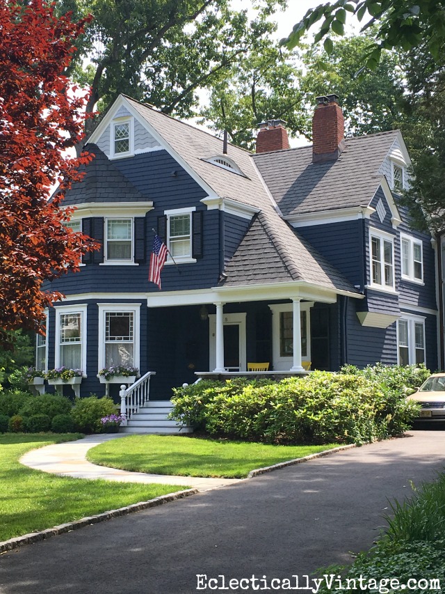 Blue House Exteriors - go bold with exterior paint like this dark blue with white trim kellyelko.com #bluehouses #bluepaint #curbappeal #bluehouse #paintcolors #exteriorpaint #blueexteriors