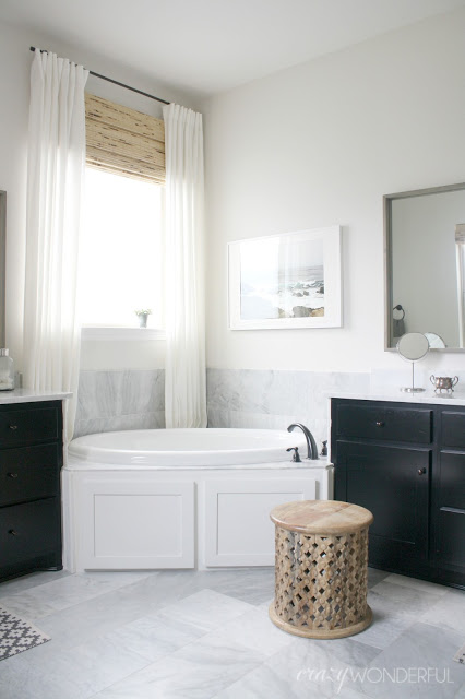 Black and white master bedroom with carrara marble floors kellyelko.com