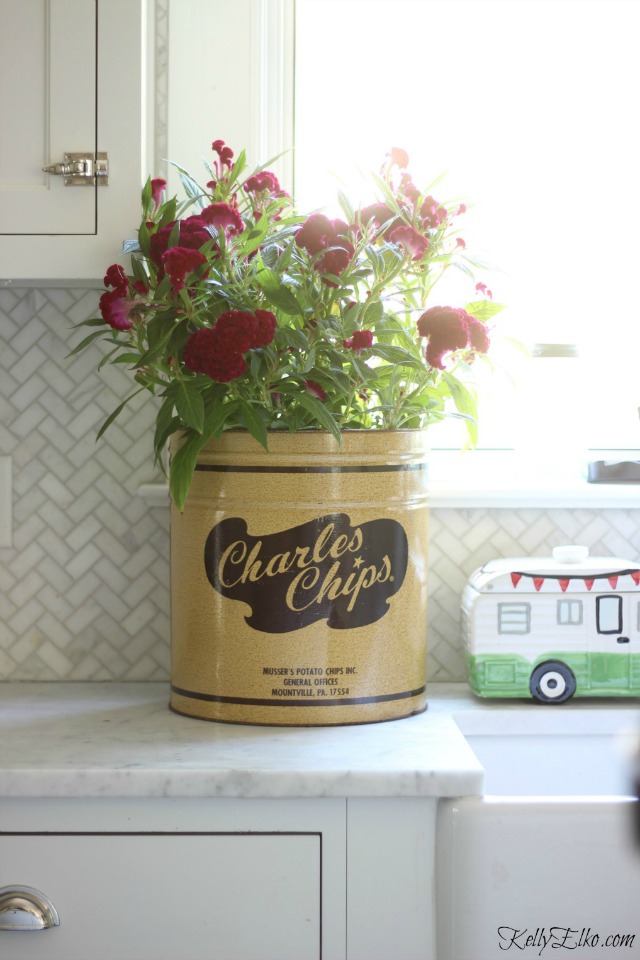 Love this vintage Charles Chips canister as a planter for fall flowers kellyelko.com