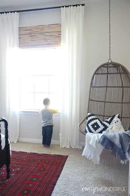 Hanging rattan swing is fun in a kids room kellyelko.com