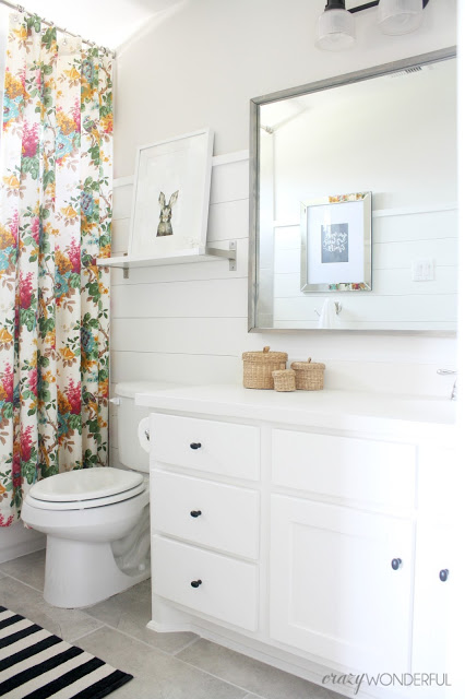 Kids white bathroom with shiplap walls kellyelko.com