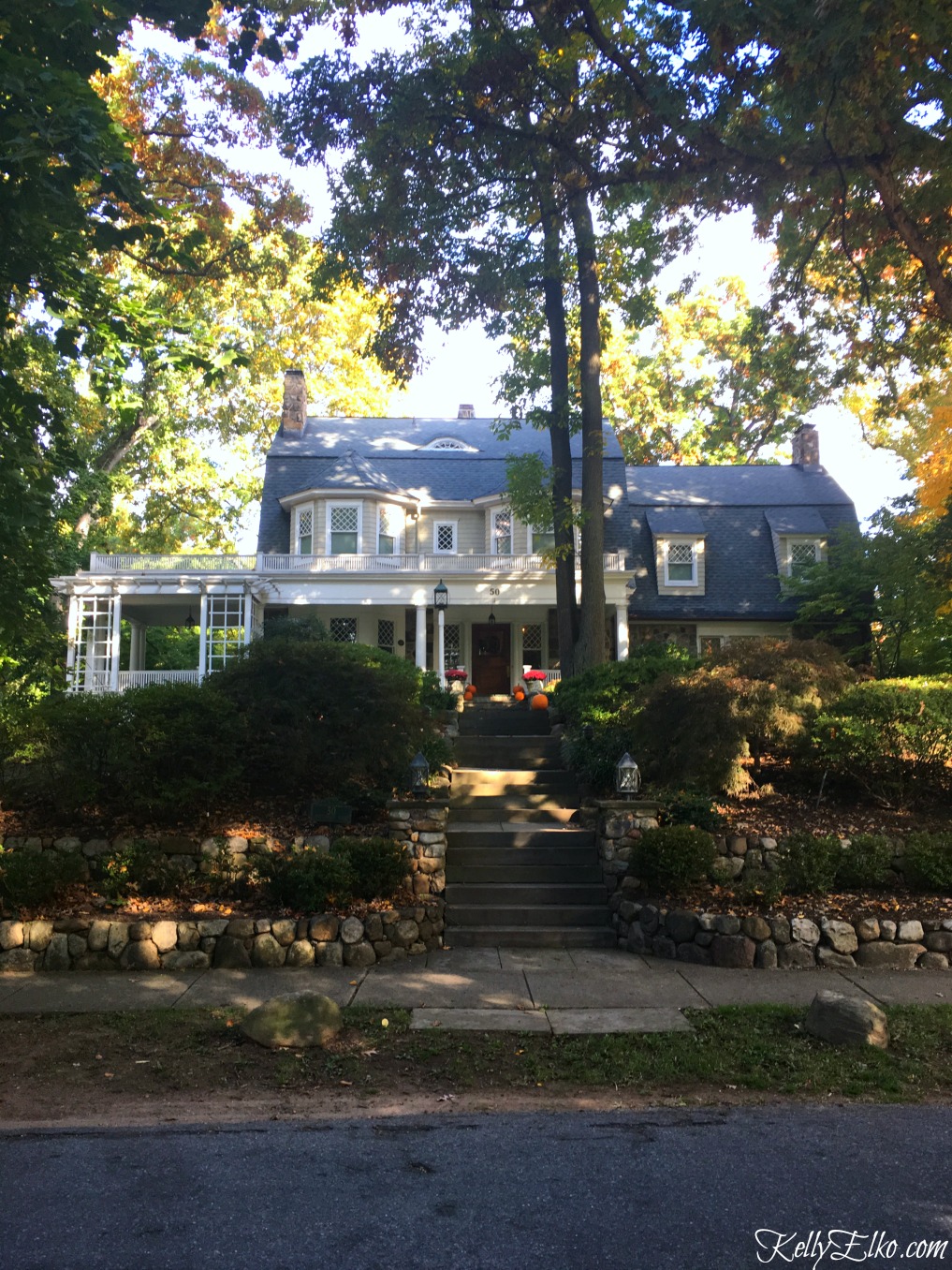 Antique house with charming stone wall - see more fall homes with curb appeal kellyelko.com