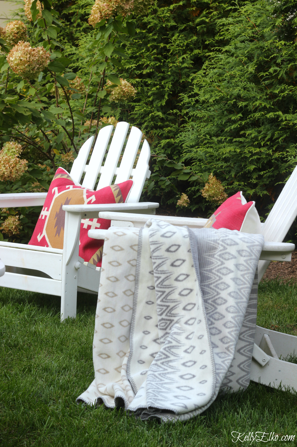 Cozy up outdoor seating with colorful pillows and cozy throws kellyelko.com