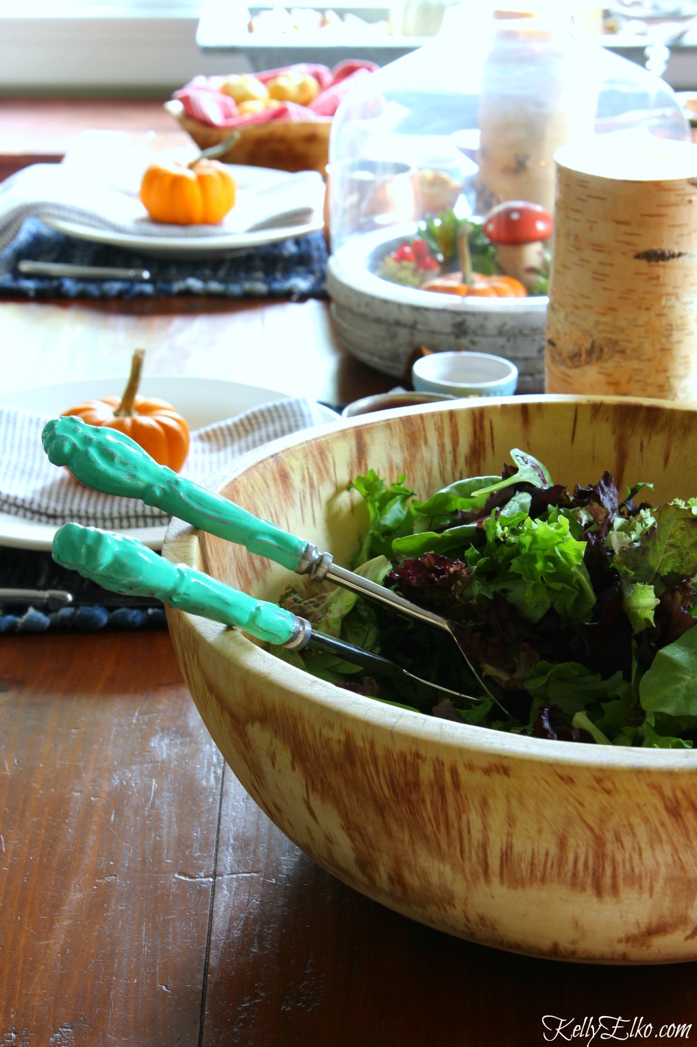 Love the rustic wood bowl on this beautiful fall table kellyelko.com