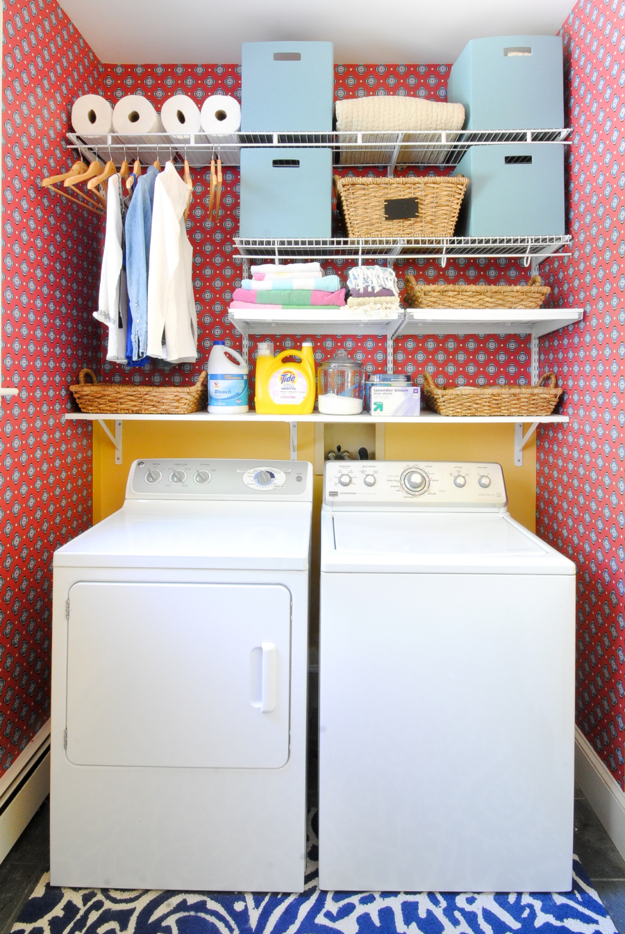 Colorful red and blue laundry room with open shelves