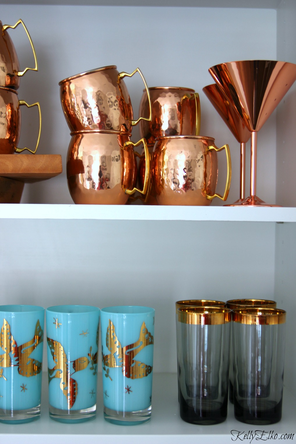 Love the copper moscow mule mugs, rose gold martini glasses and vintage drinking glasses on display kellyelko.com