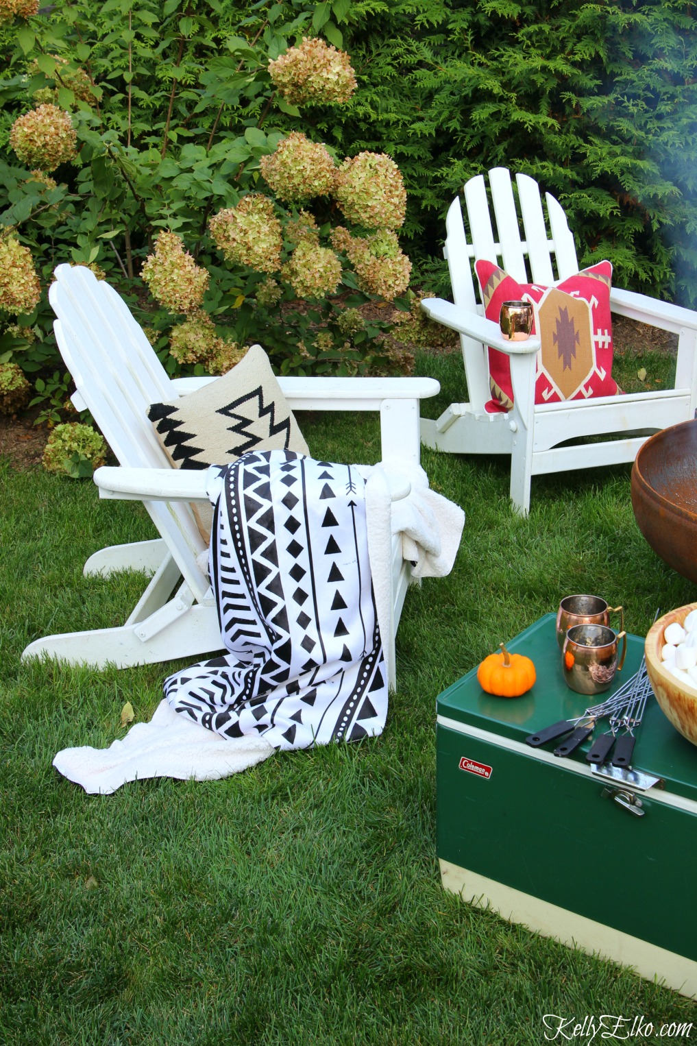 Cozy outdoor seating area - love the boho throws and pillows kellyelko.com