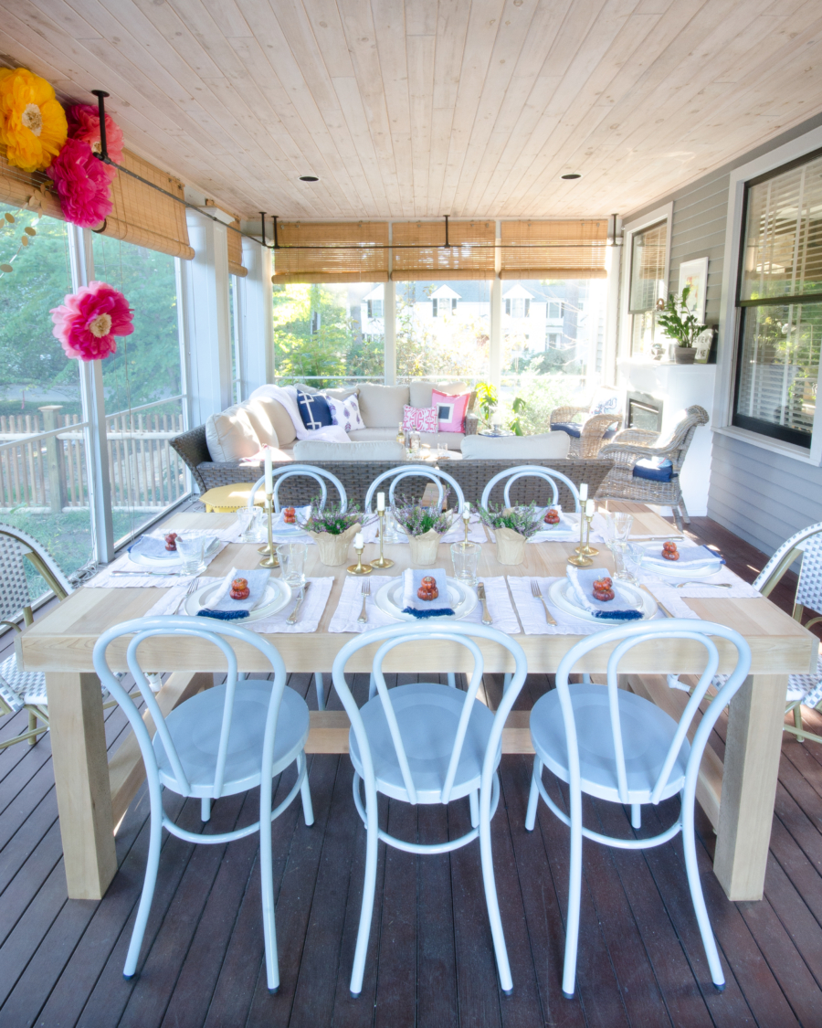 Love the bent wood chairs in this screened in porch 