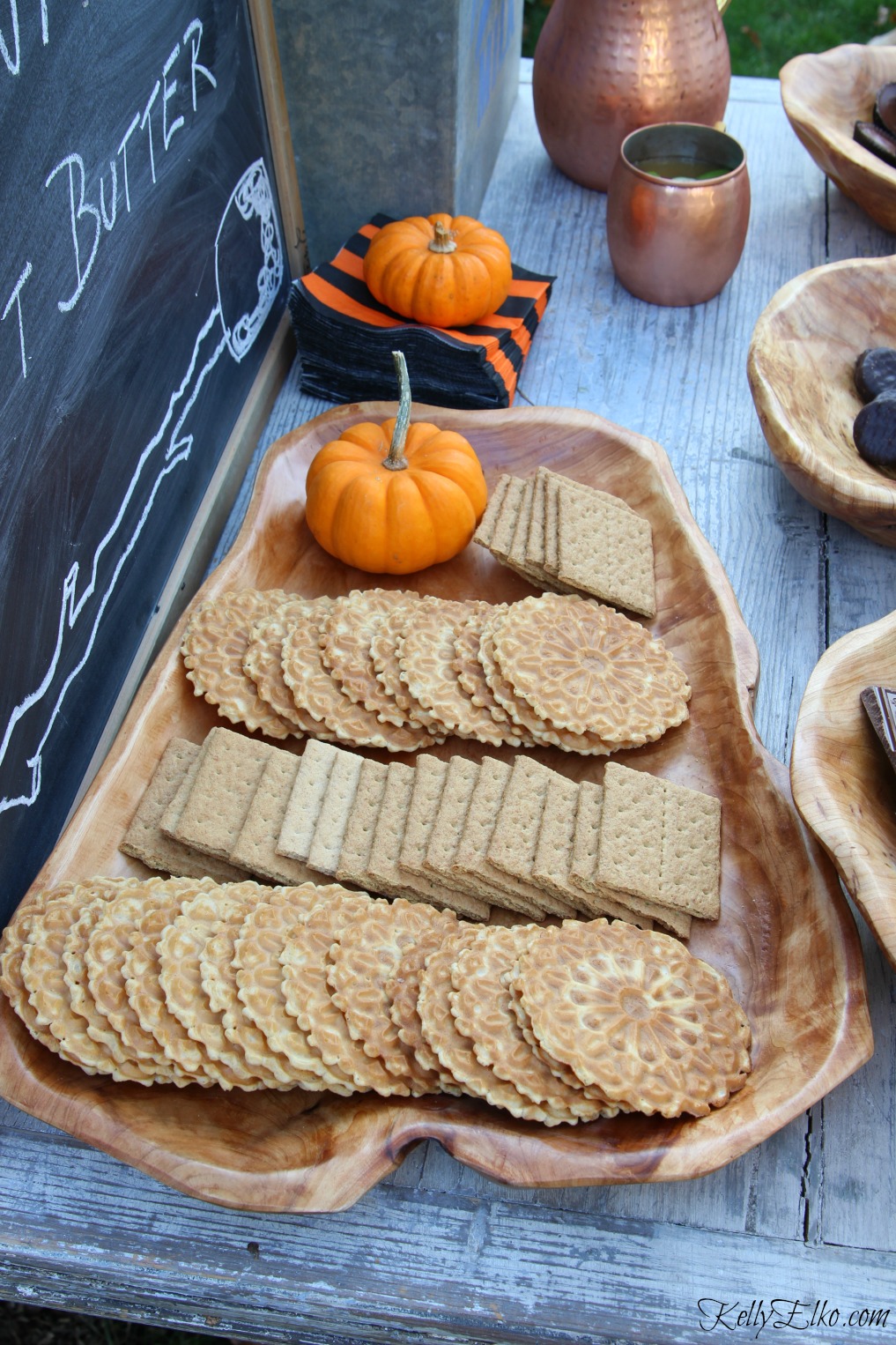 Love this wood platter filled with s'mores fixings - graham crackers and pizzelle cookies kellyelko.com