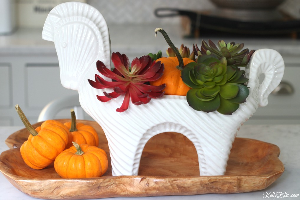 Faux succulent fall centerpiece - love the mid century style horse vessel kellyelko.com