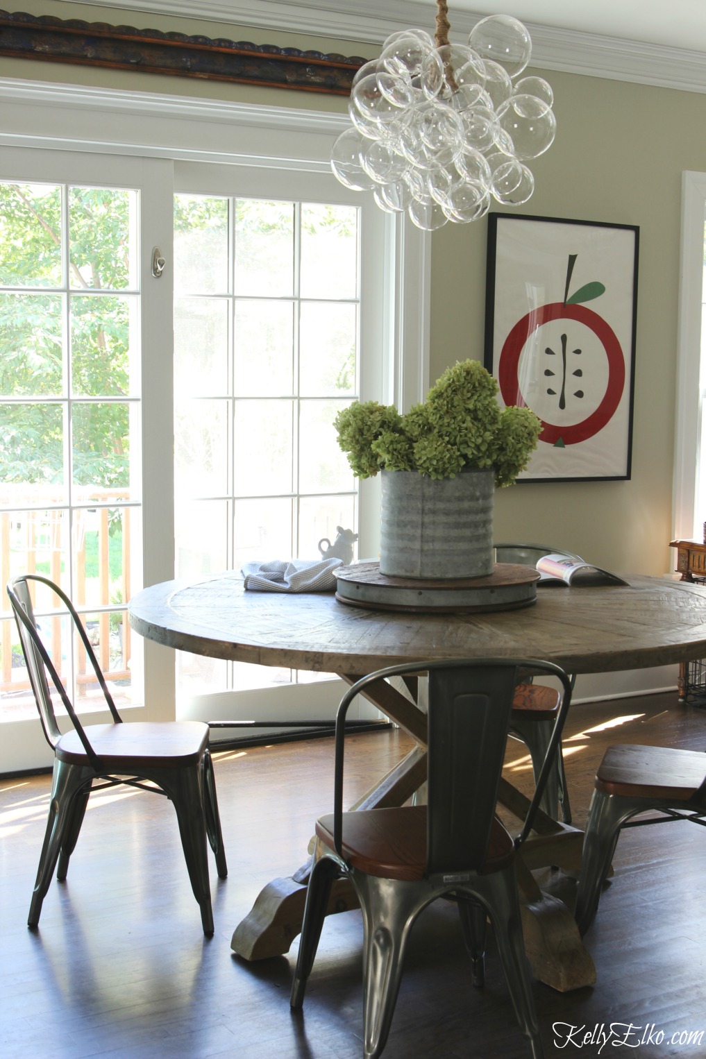 Wow - love the modern bubble chandelier paired with farmhouse kitchen table kellyelko.com