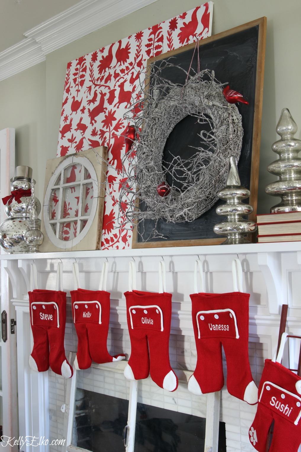 Love this festive Christmas mantel with otomi stencil, mercury glass snowmen and trees and the cutest long john stockings kellyelko.com