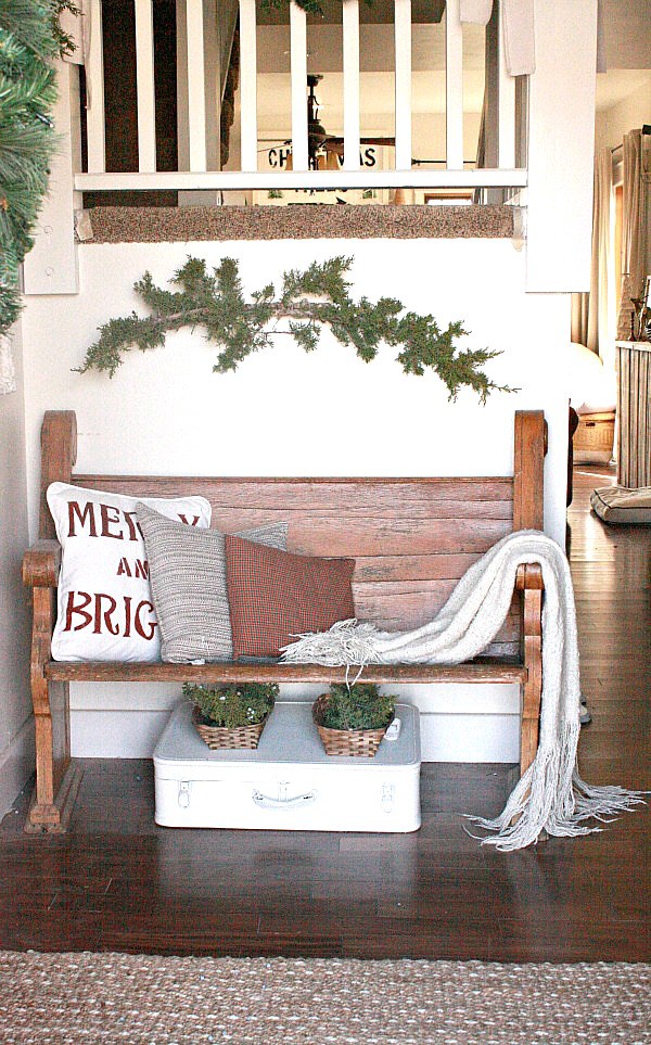 Love this little church pew in this farmhouse foyer