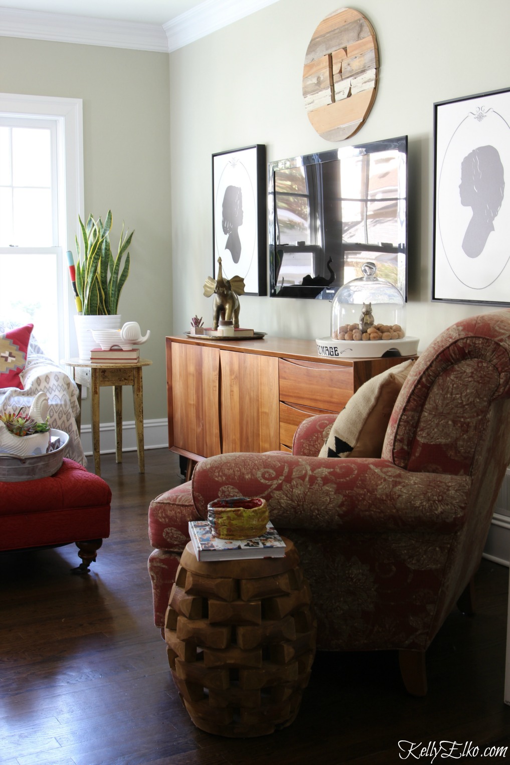 Love this cozy, eclectic family room with gorgeous mid century media console kellyelko.com