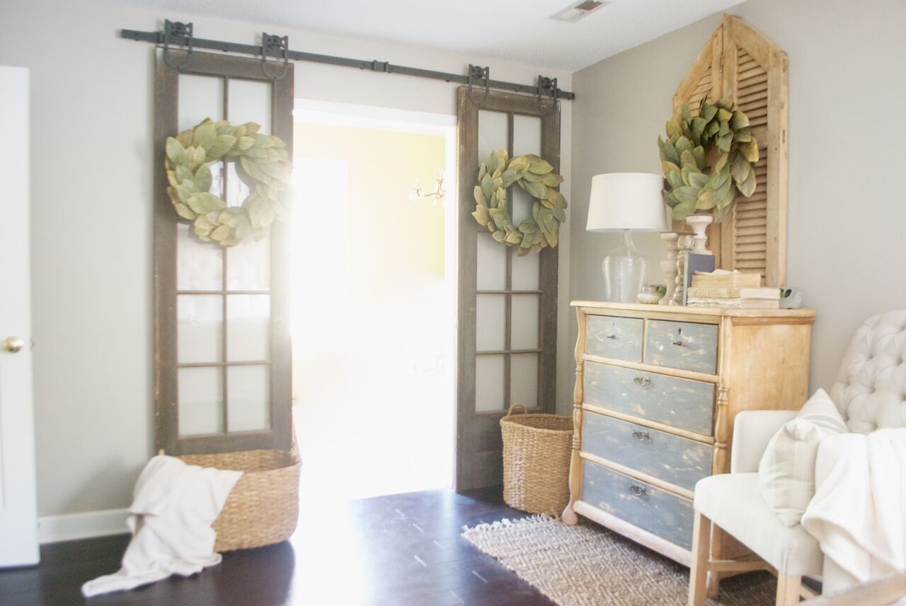 Double sliding barn doors with magnolia wreaths