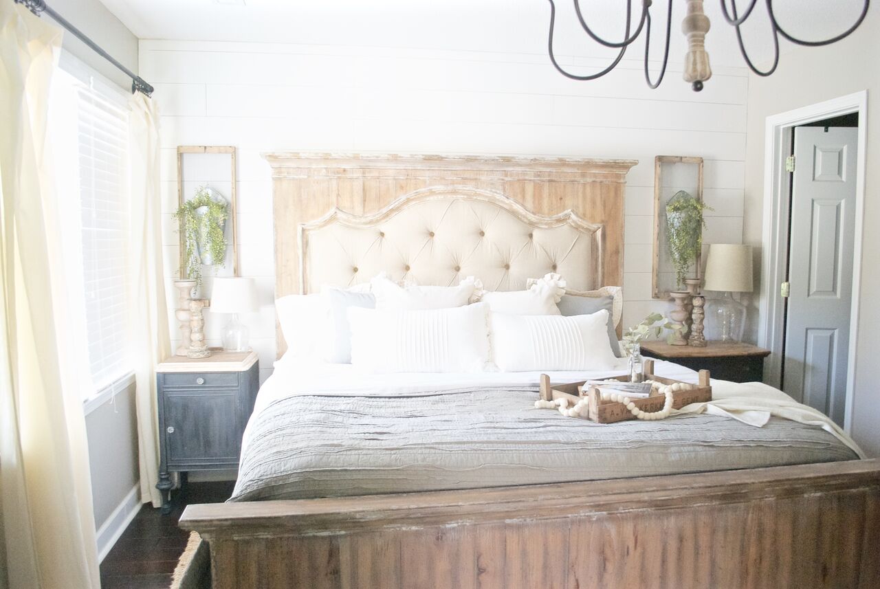 Neutral farmhouse bedroom with shiplap walls