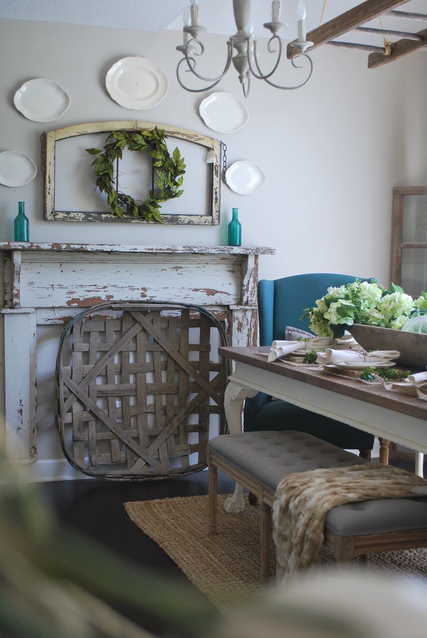 Farmhouse dining room with chippy old mantel and tobacco basket 