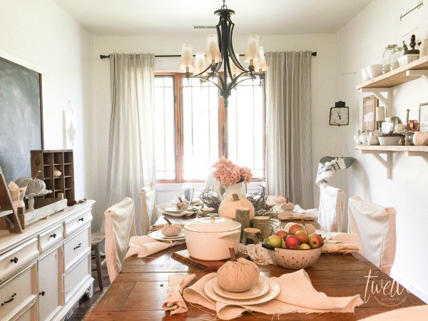 Farmhouse dining room with open shelves and giant chalkboard