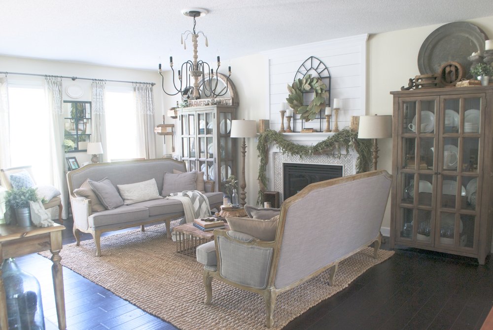 Farmhouse living room with double sofas and shiplap mantel 