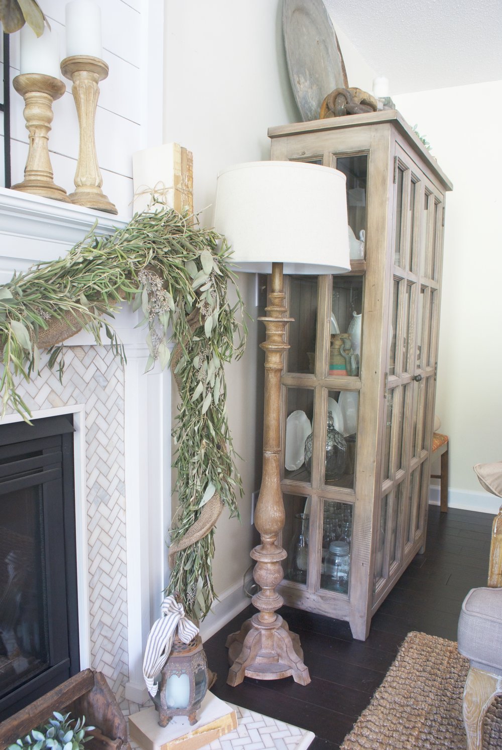 Farmhouse living room - love the herringbone tile on the fireplace 