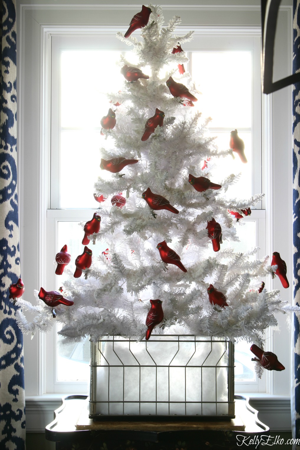 White Christmas tree filled with a flock of red cardinals kellyelko.com #christmastree #whitechristmastree #whitetree #vintagechristmas #christmasdecor #farmhousechristmas #kellyelko #cardinals 