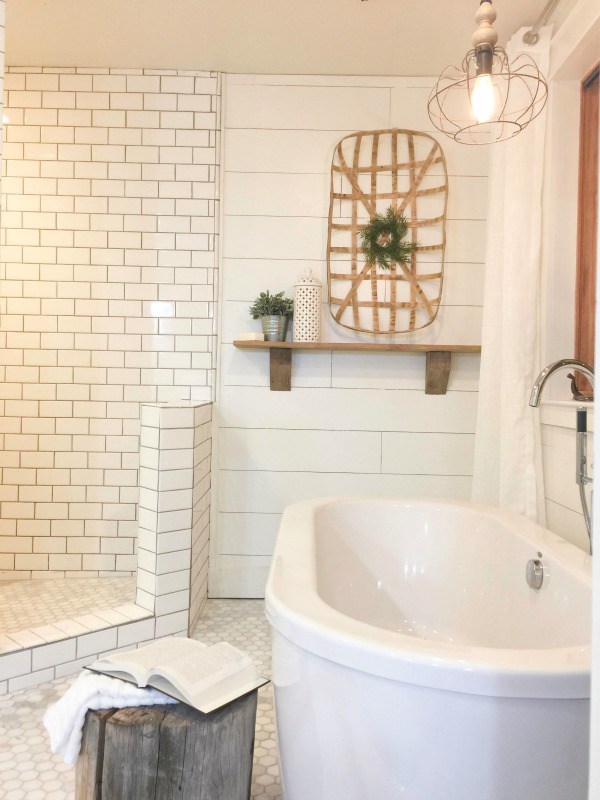 Love the modern freestanding bathtub and open shower with subway tile