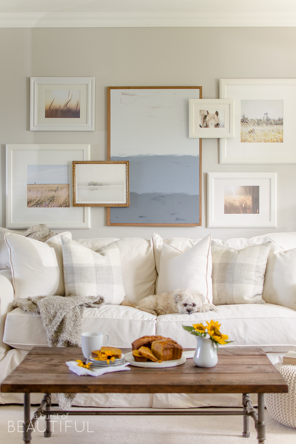 Eclectic Home Tour - A Burst of Beautiful - I love the layered gallery wall and her neutral farmhouse style