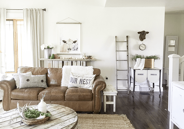 Cozy farmhouse family room with leather sofa 