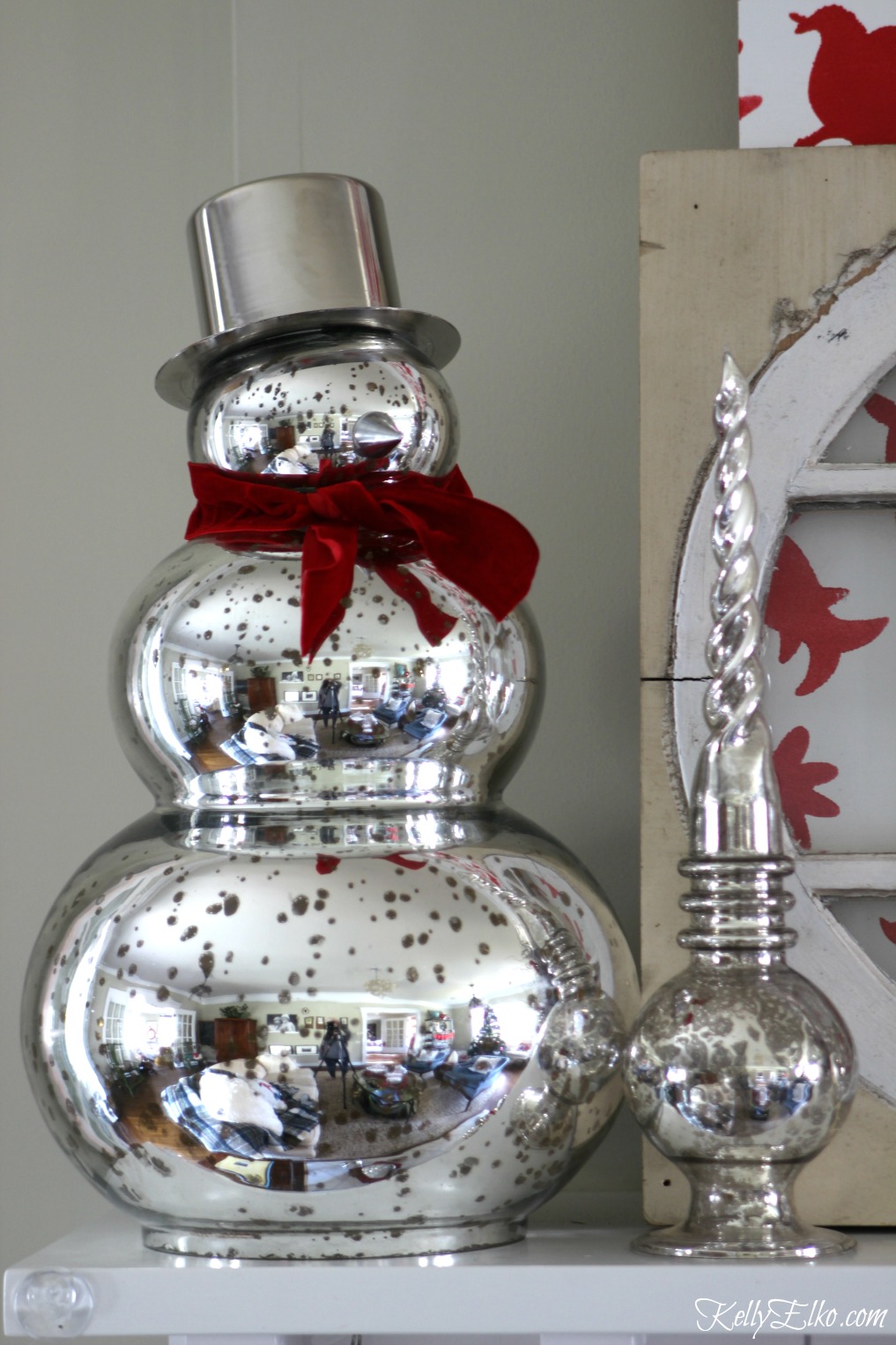 Mercury glass snowman on a festive Christmas mantel kellyelko.com