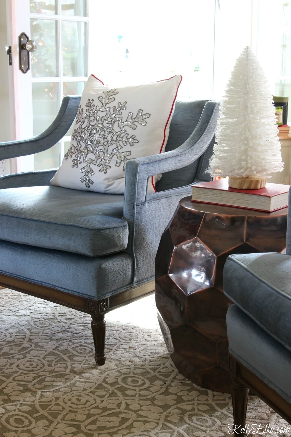 Love this blue velvet mid century club chair with festive snowflake pillow kellyelko.com