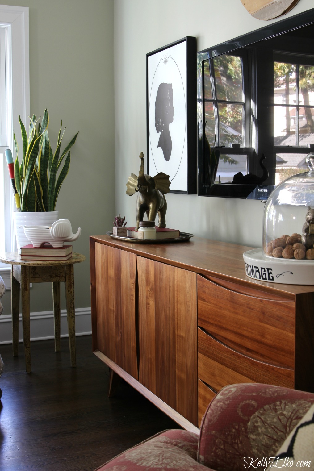 Love the Danish modern media console in this cozy family room kellyelko.com