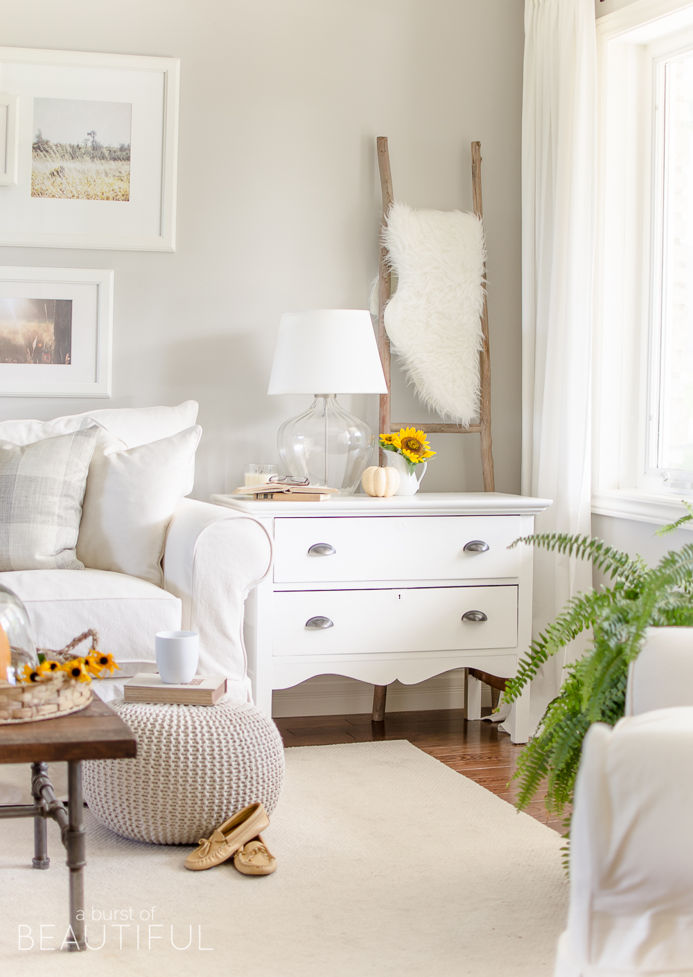 Neutral living room - love all the texture from accessories and plants